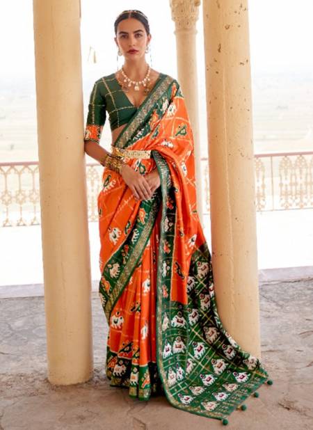 Orange And Green Colour REWAA RIYASAT Festive Wear Smuth Patola Designer Saree Collection R-350J